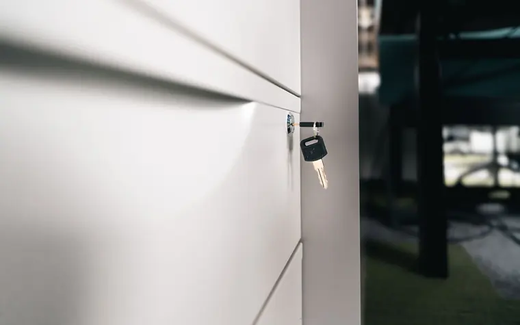 Key secured in an office locker lock.