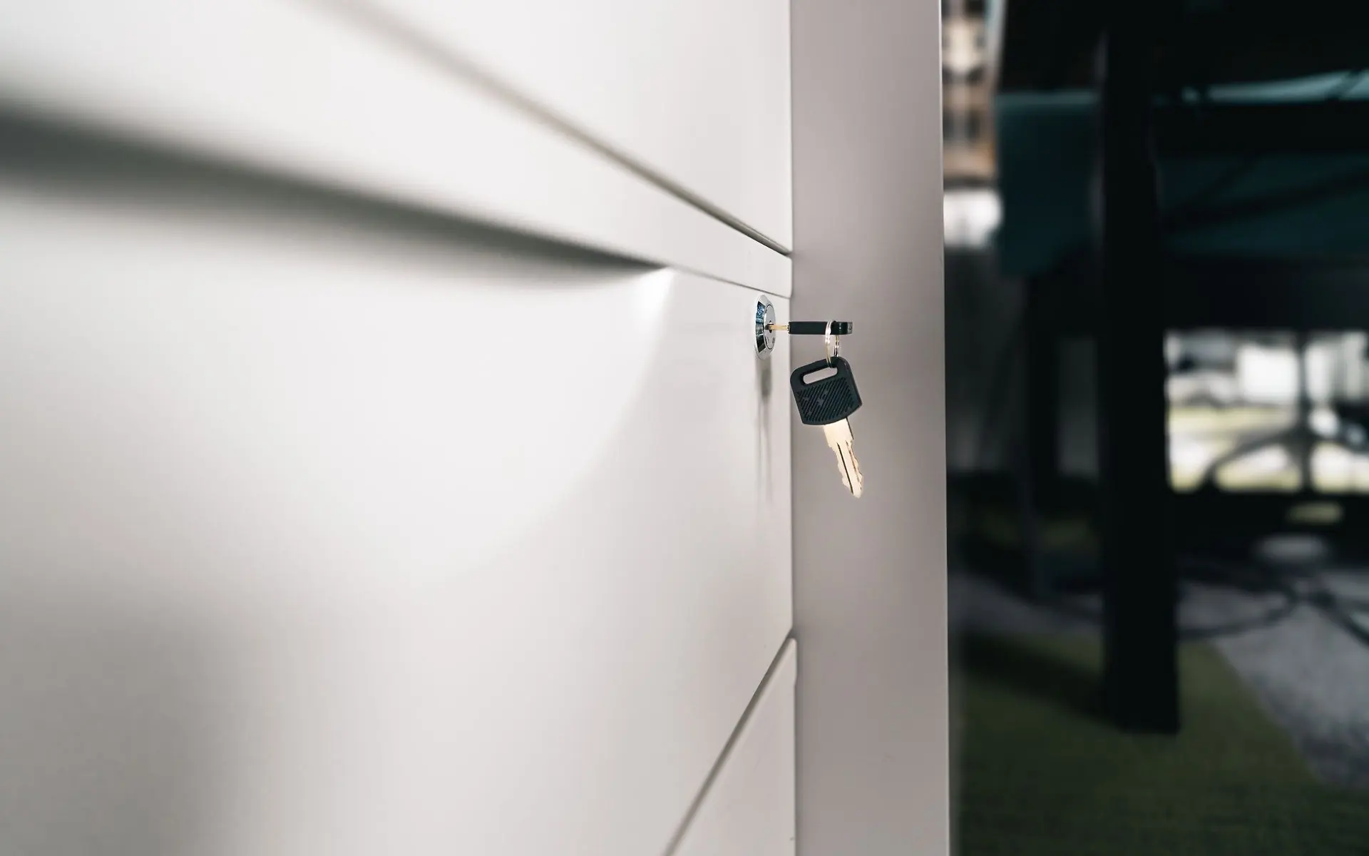 Key secured in an office locker lock.