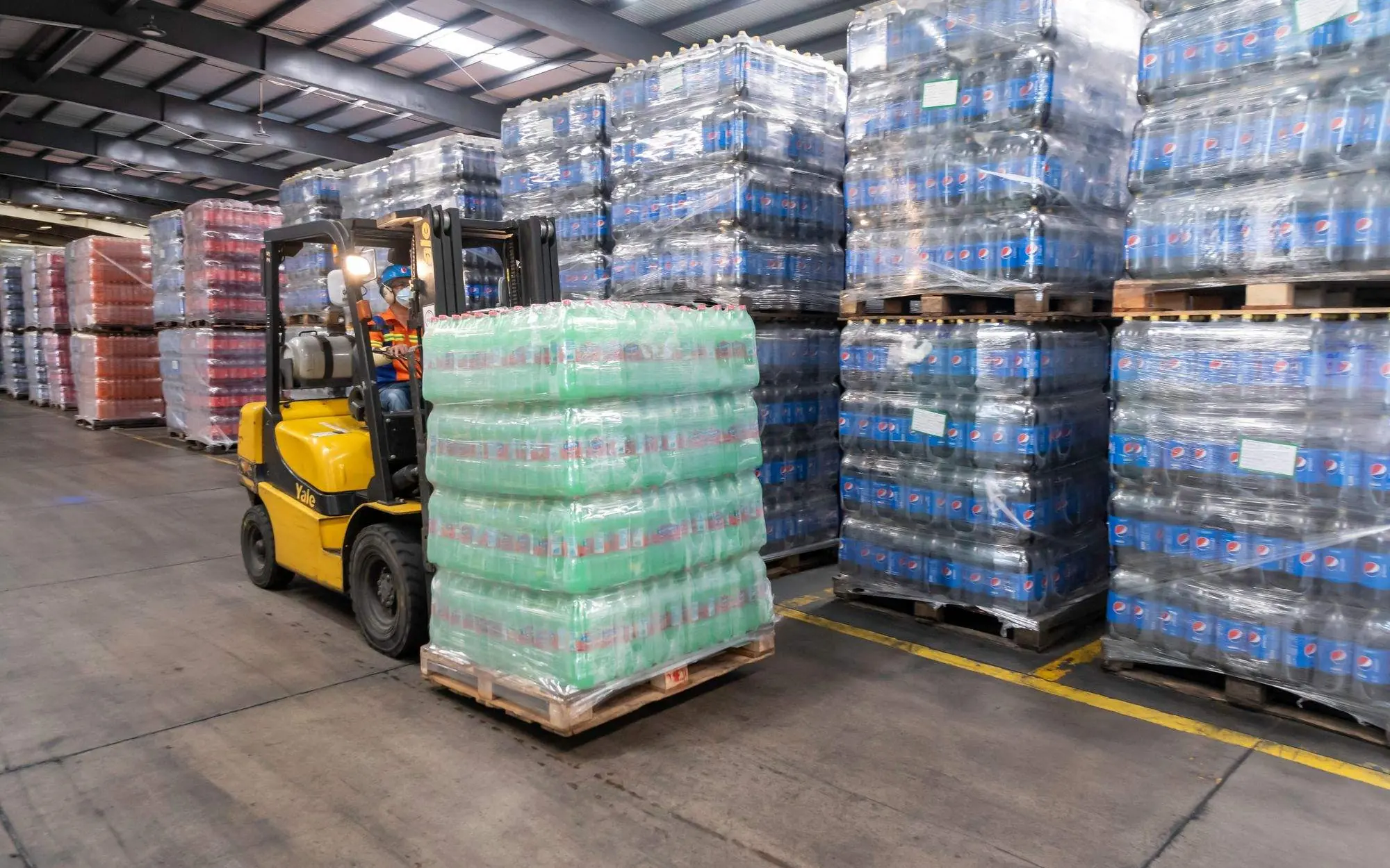 Forklift moving warehouse inventory before marketing automation rollout.