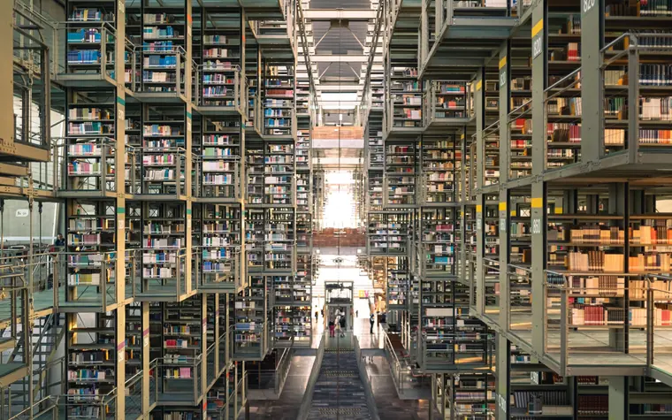Modern library with extensive book stacks.