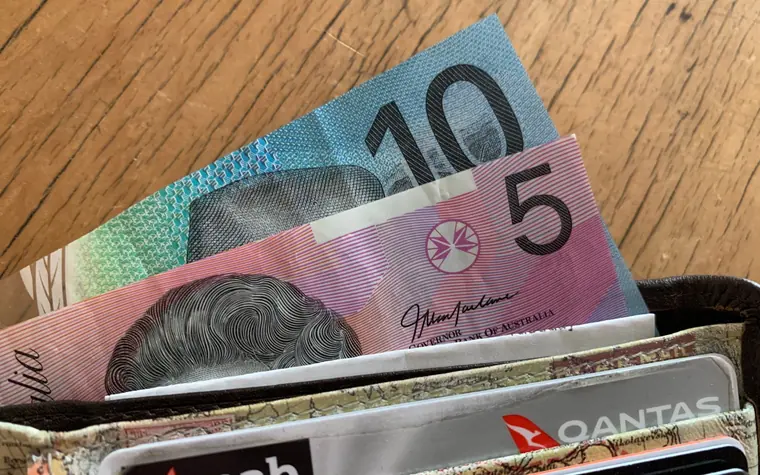 Australian dollar notes in a wallet.
