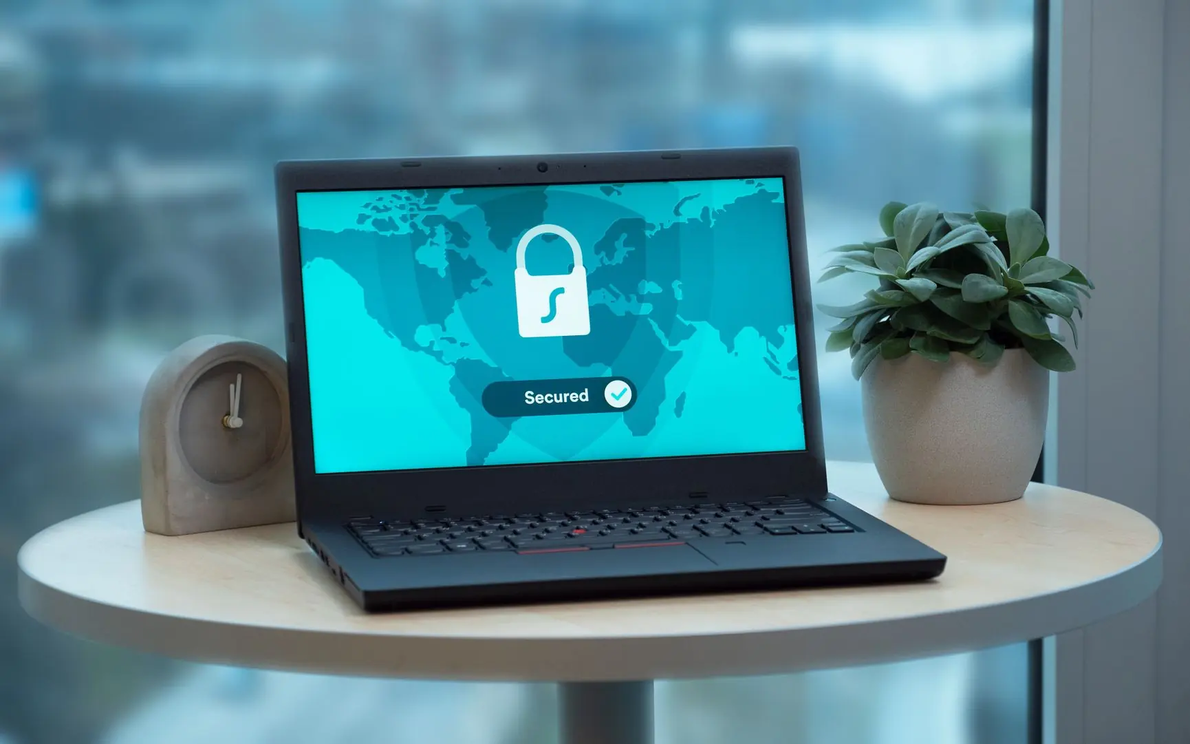 Laptop showing a padlock on a secured screen.