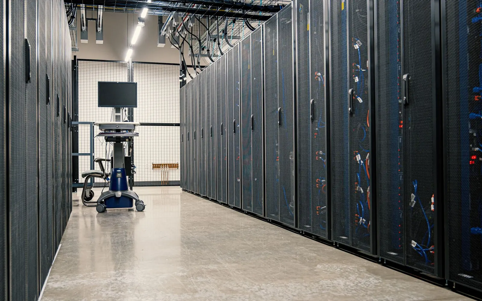 Rows of server cabinets in a data centre.