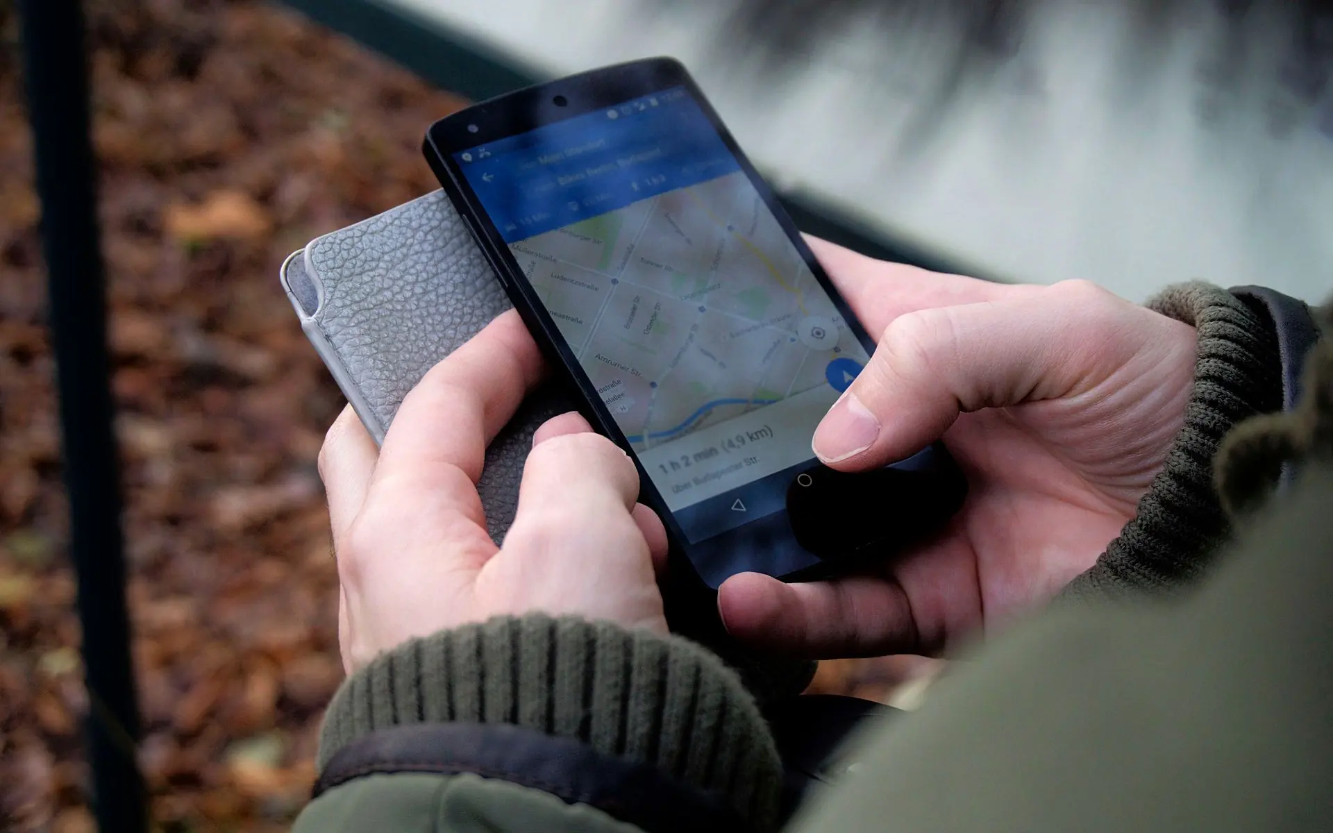 Person using a maps app on a smartphone.