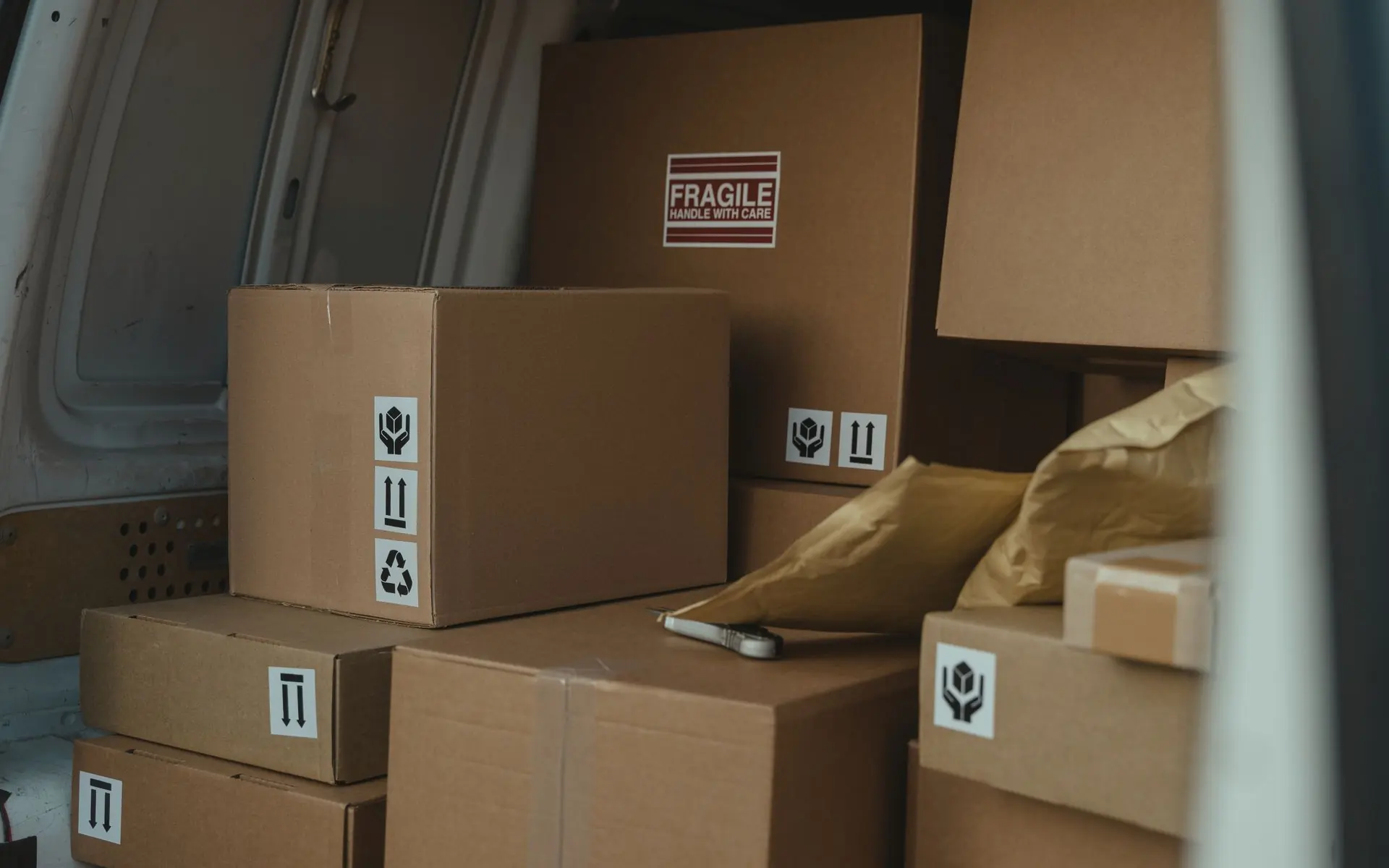 Delivery boxes stacked inside a warehouse truck.