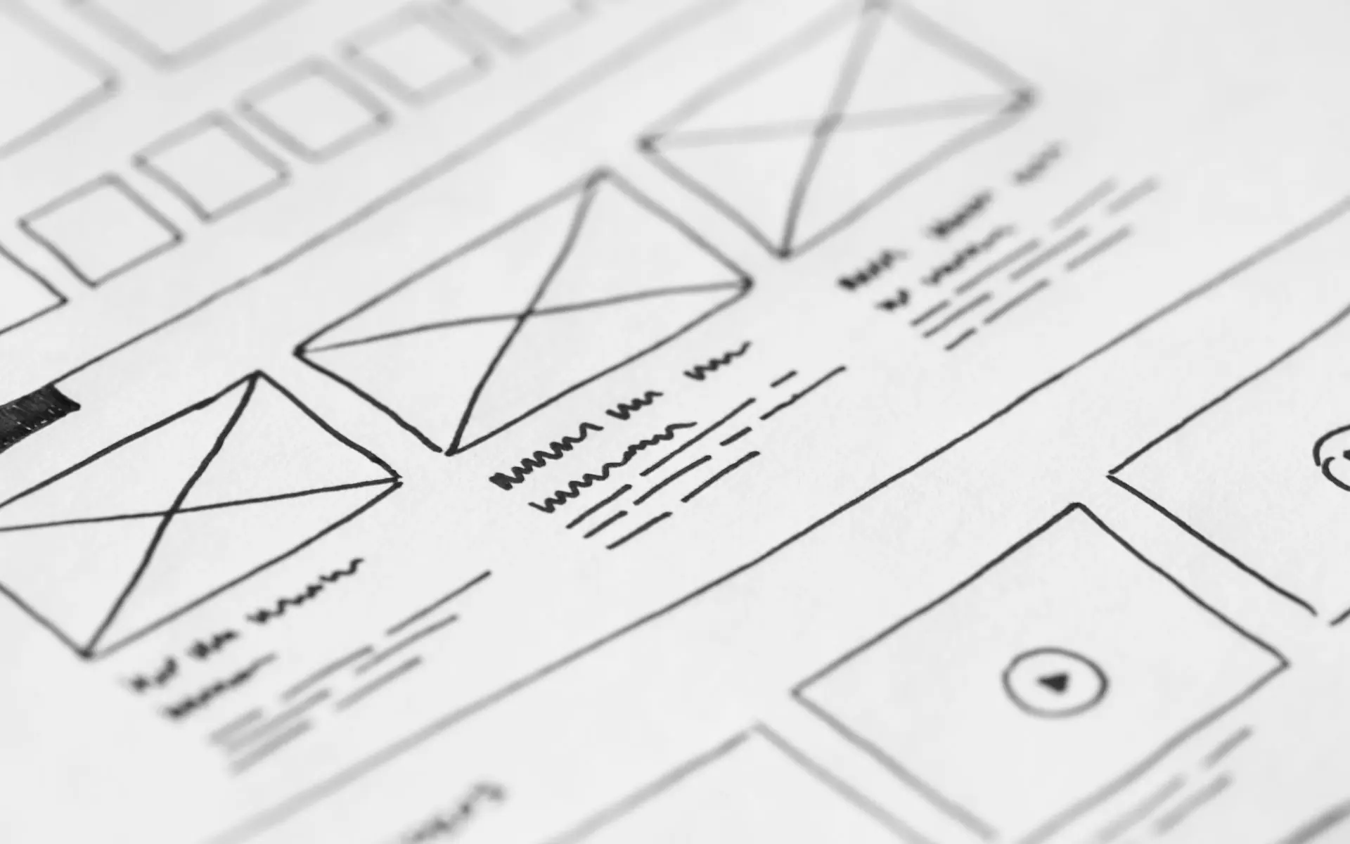 Hand drawn website wireframe sketches on paper.