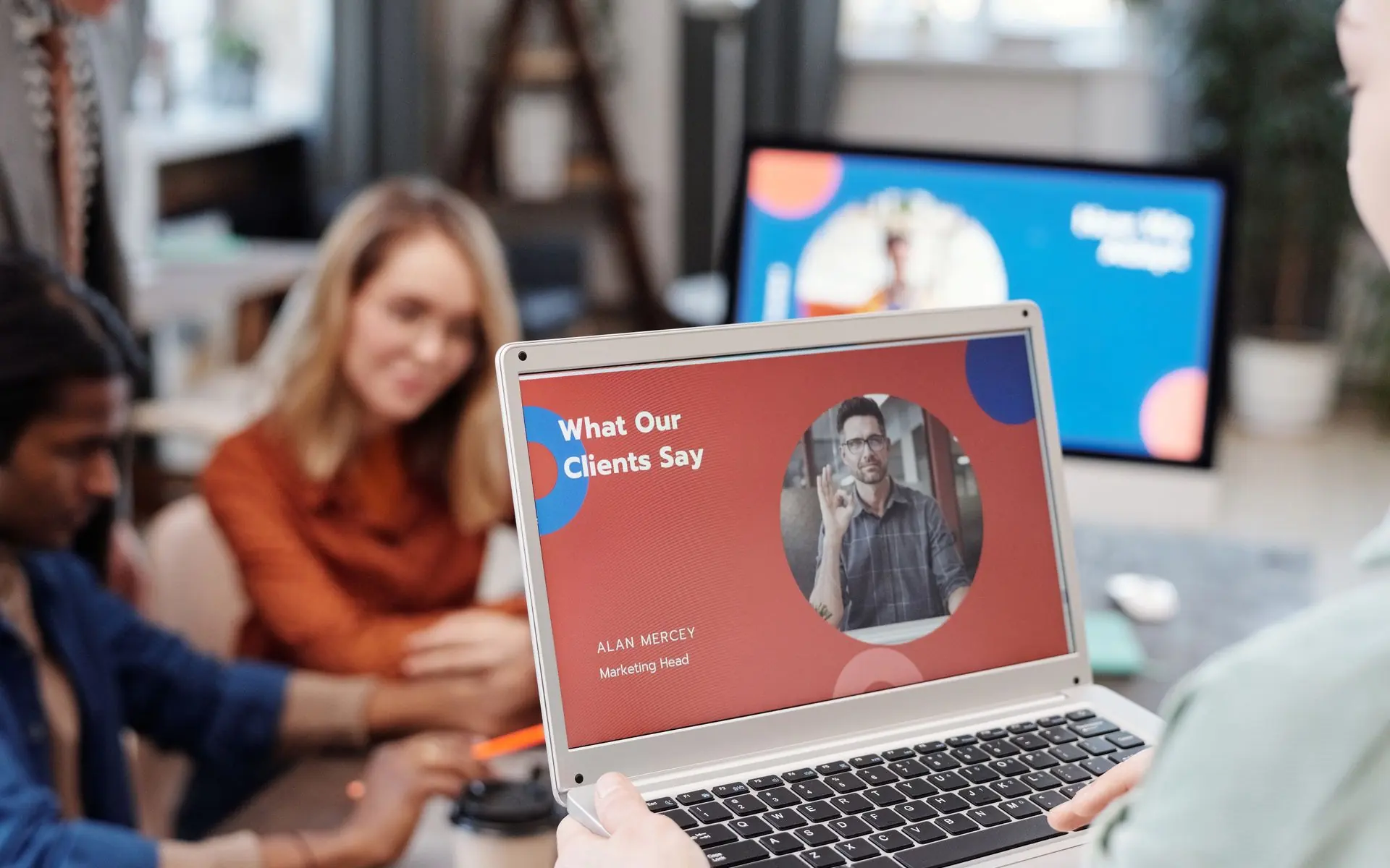 Team reviewing a website on a laptop.