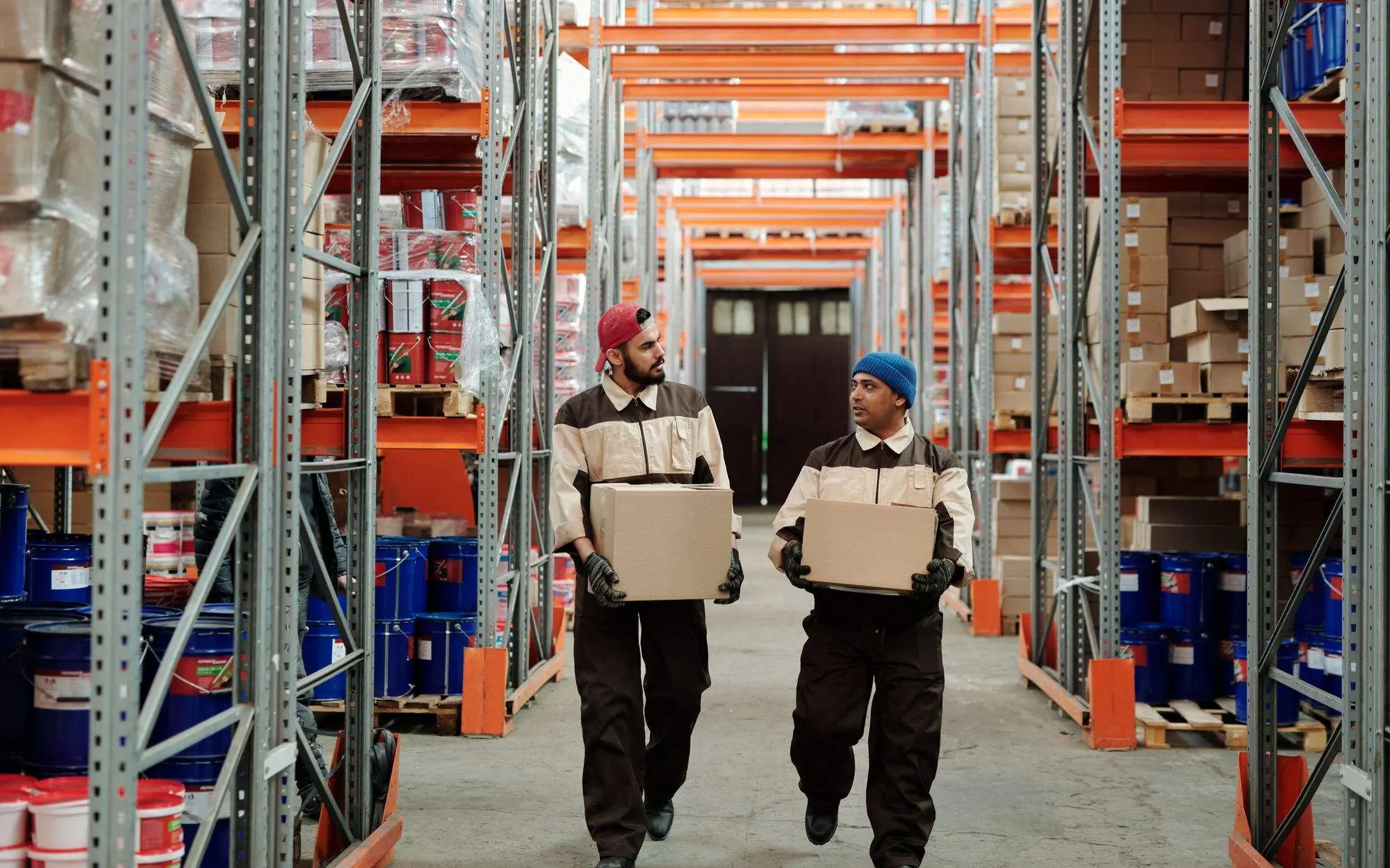 Warehouse workers carrying boxes.