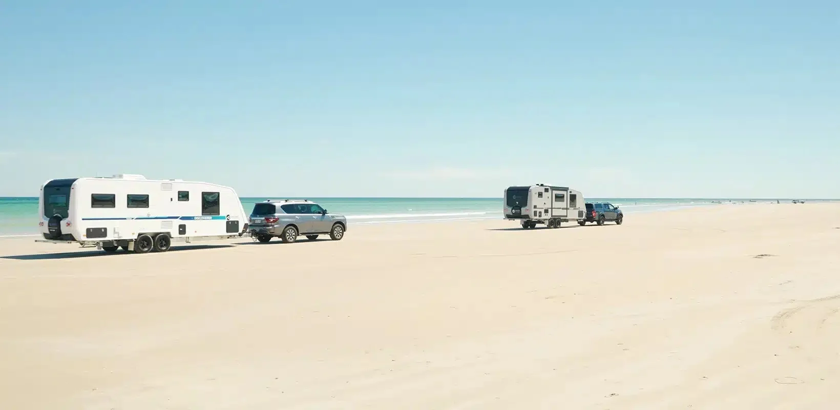 Regent caravans parked on an Australian beach.