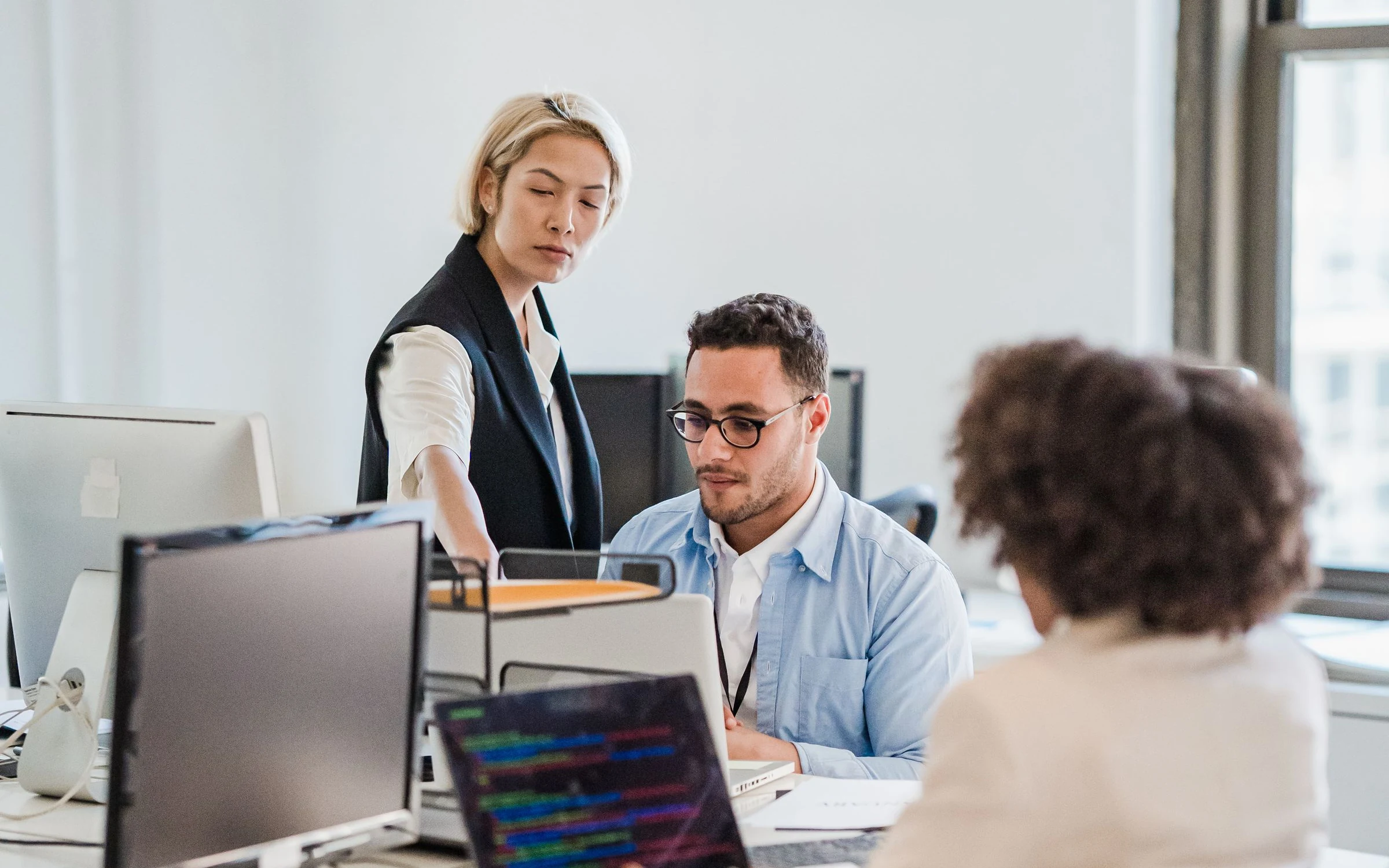 Support team working together at their desks.