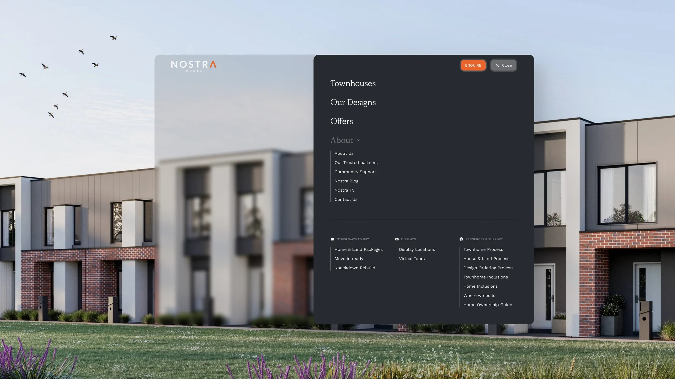 Modern Nostra Homes townhouse development at dusk representing the completed brand experience.