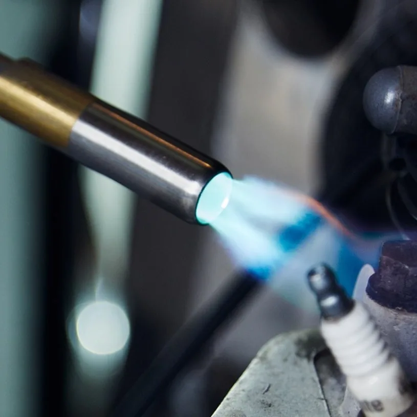 Gas torch being used on a metal fitting.