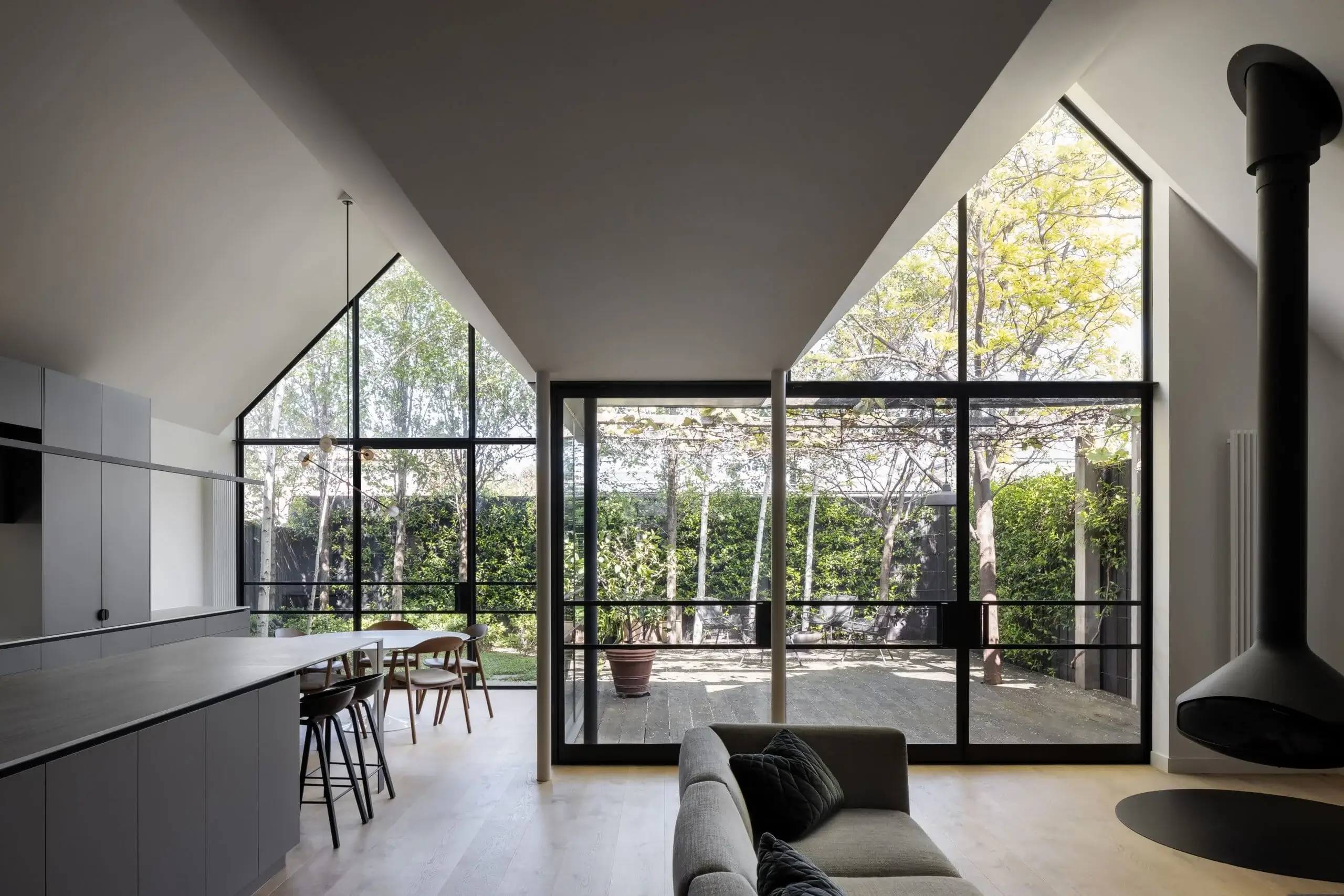 Contemporary interior with black-framed windows.