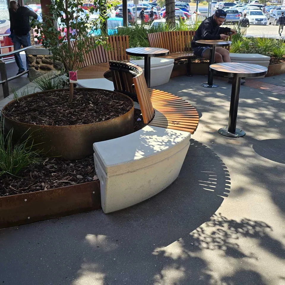 People gathered around an outdoor table.