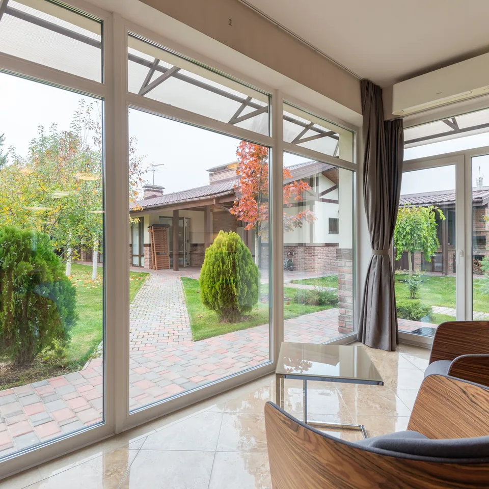 View through large windows in a home interior.