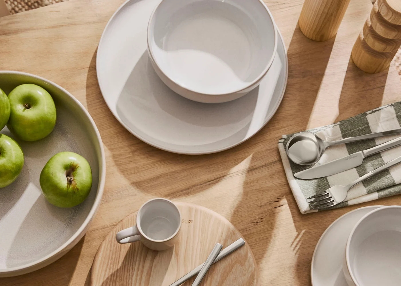 Styled Salt & Pepper tableware on a timber table.