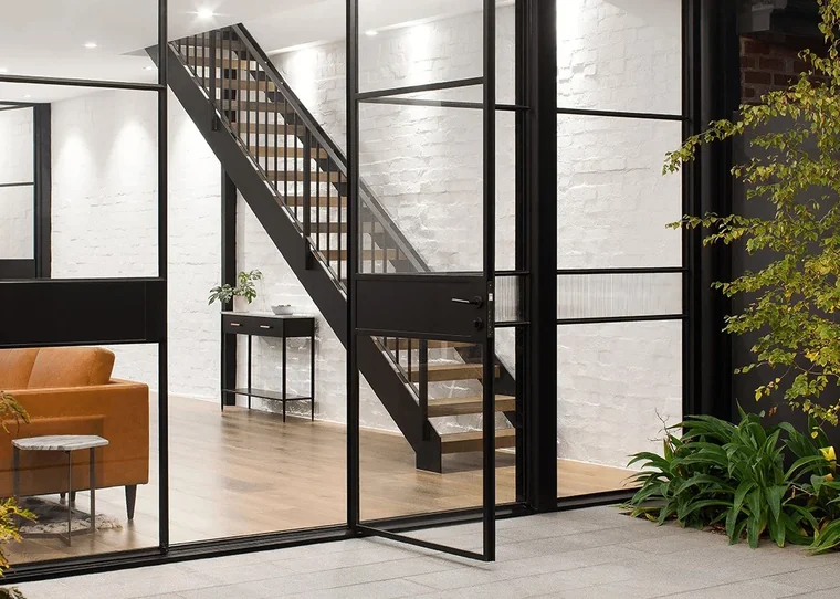 Steel-framed windows and doors in a contemporary interior.