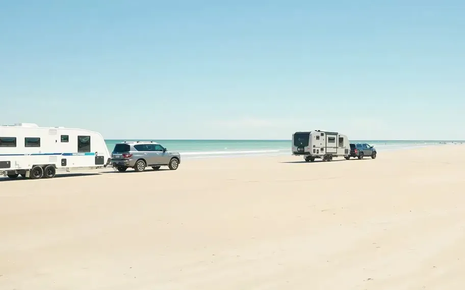 Regent caravans parked on an Australian beach.