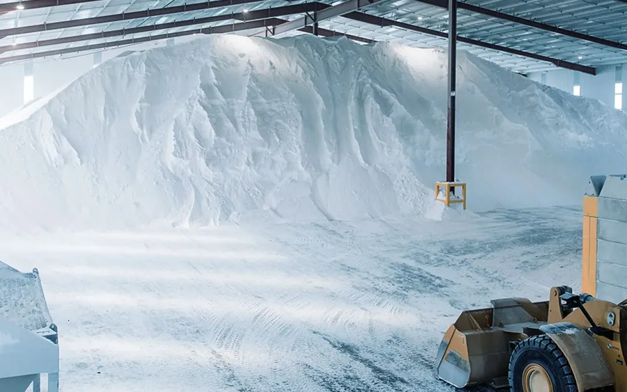 Bulk salt stockpile and loader inside the Natrio warehouse.