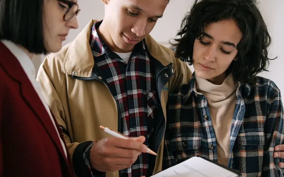 Finance advisers reviewing documents.