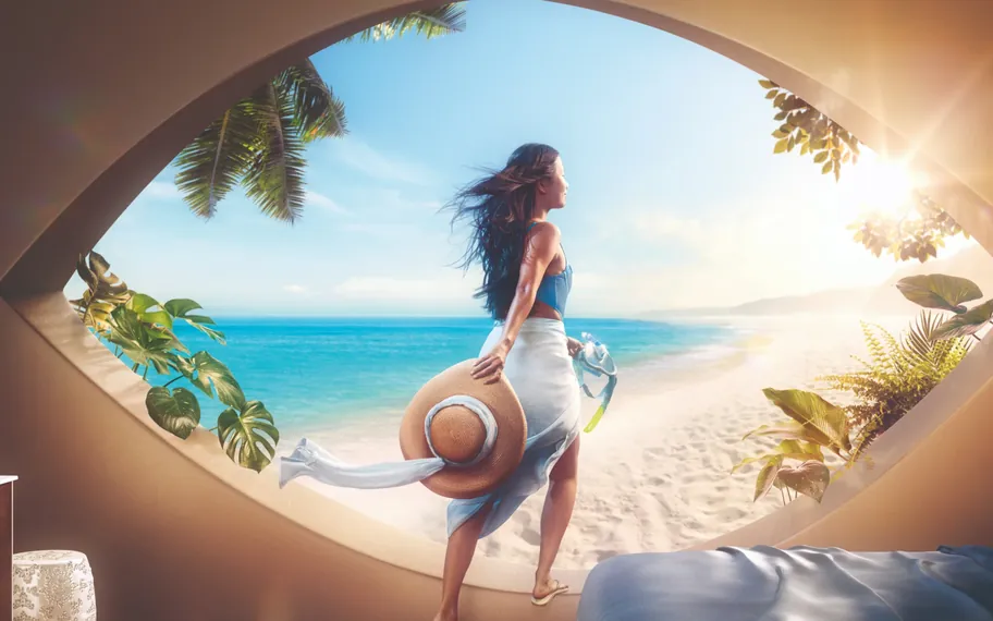 Johnson & Johnson Vision campaign image of a woman stepping through an eye shaped window onto a beach.