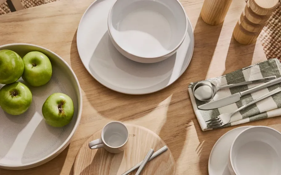 Styled Salt & Pepper tableware on a timber table.