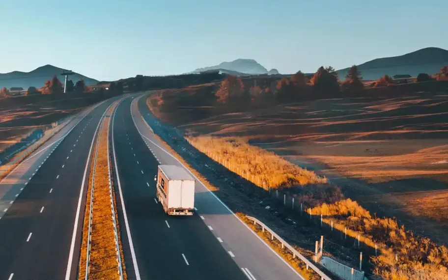 G & V Logistics truck travelling on a rural highway.