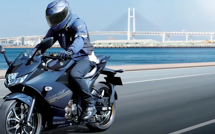 Suzuki Motorcycles, suzuki rider on a Gixxer motorcycle in motion.