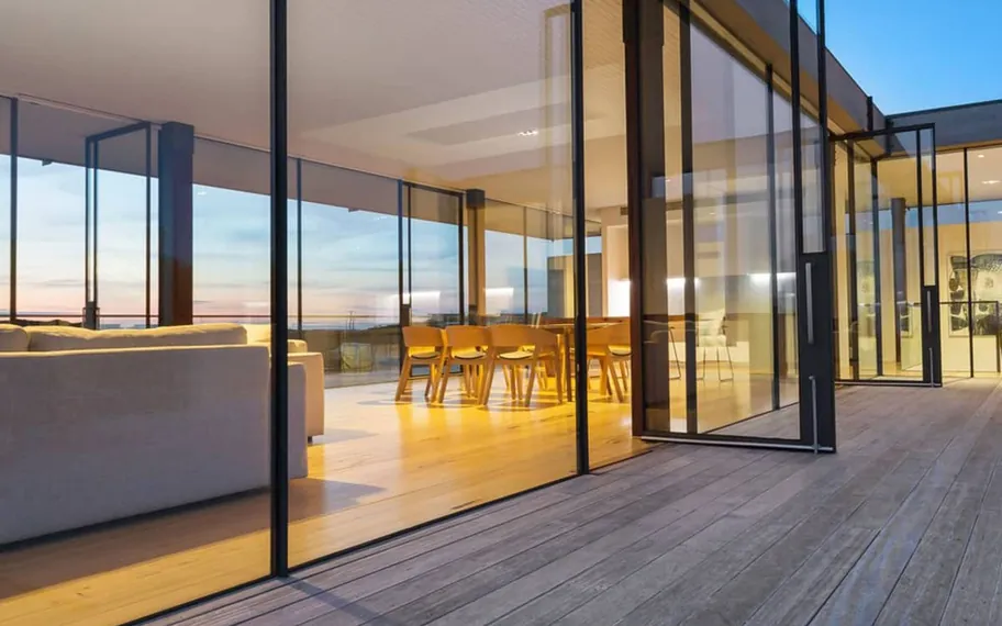 Timber-clad modern home at dusk.