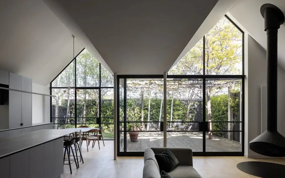 Contemporary interior with black-framed windows.