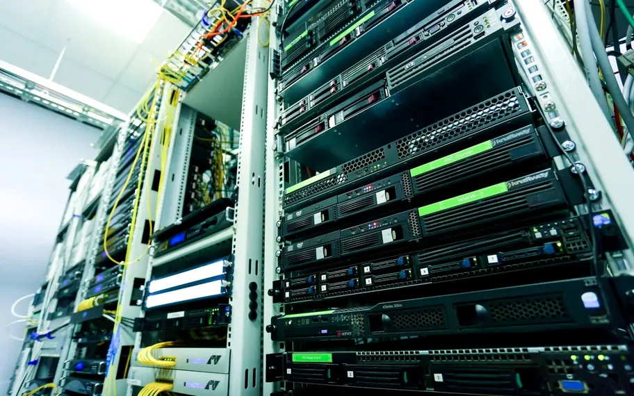 Rack of network servers with patch cabling.