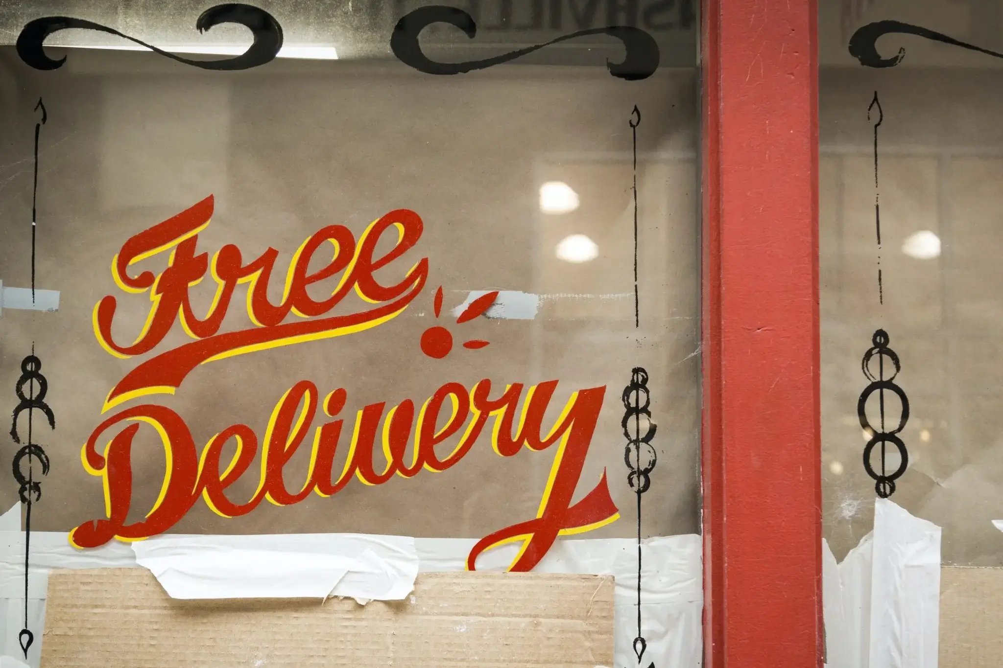 Free Delivery Sign on Glass