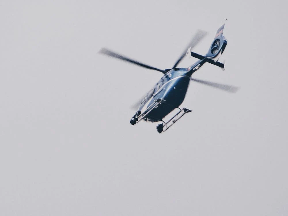 Blue Helicopter in Sky